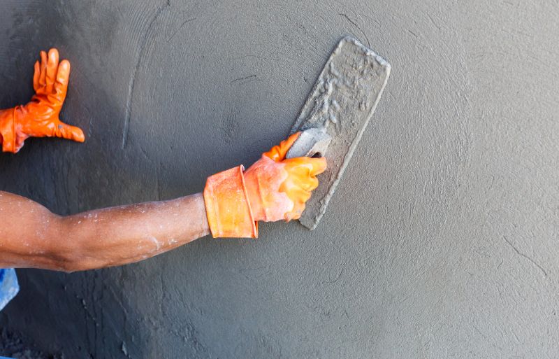concrete-mixers-plasterer-concrete-worker-at-wall-of-house-construction-36776126-min