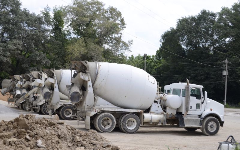 cement-mixers-cement-trucks-at-a-quarry--min