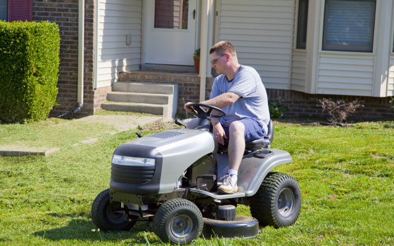 ride-on-mower-in-front-of-home-min