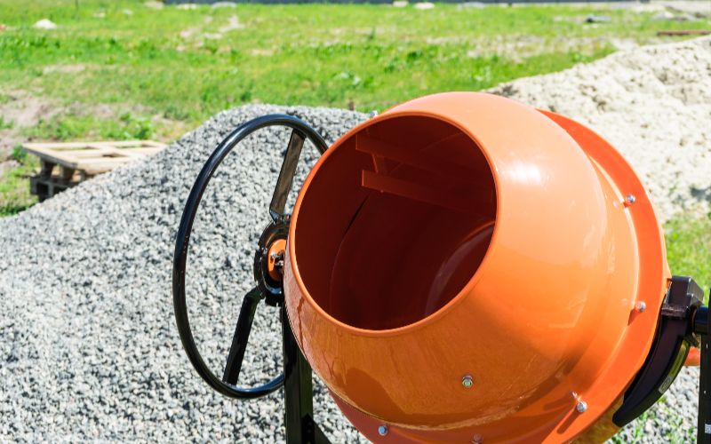 Bs Power- concrete mixer for sale -photo-concrete-mixer-installed-on-the-construction-site-next-to-a-pile-of-sand-and-gravel-min