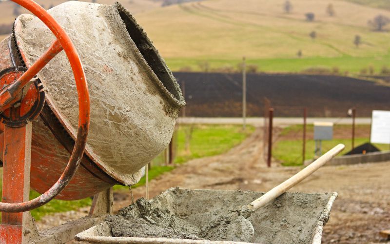 concrete-mixer-close-up-of-concrete-mixer-and-wheelbarrow-min