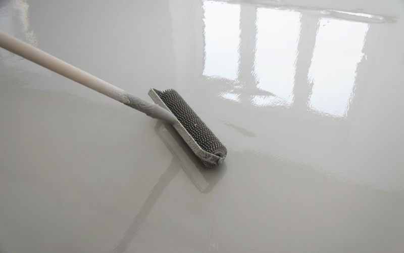 concrete-mixer-leveling-cement-floors-with-a-roller-min
