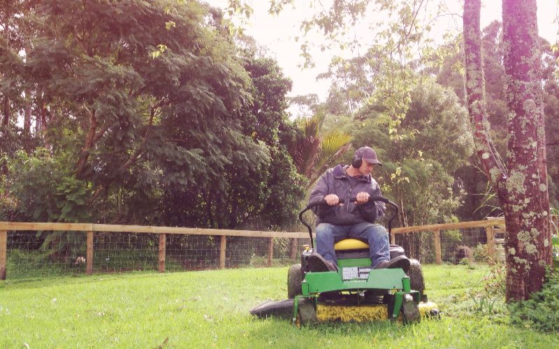 ride on mower-baby-boomer-mowing-grass-on-ride-on-mower-min