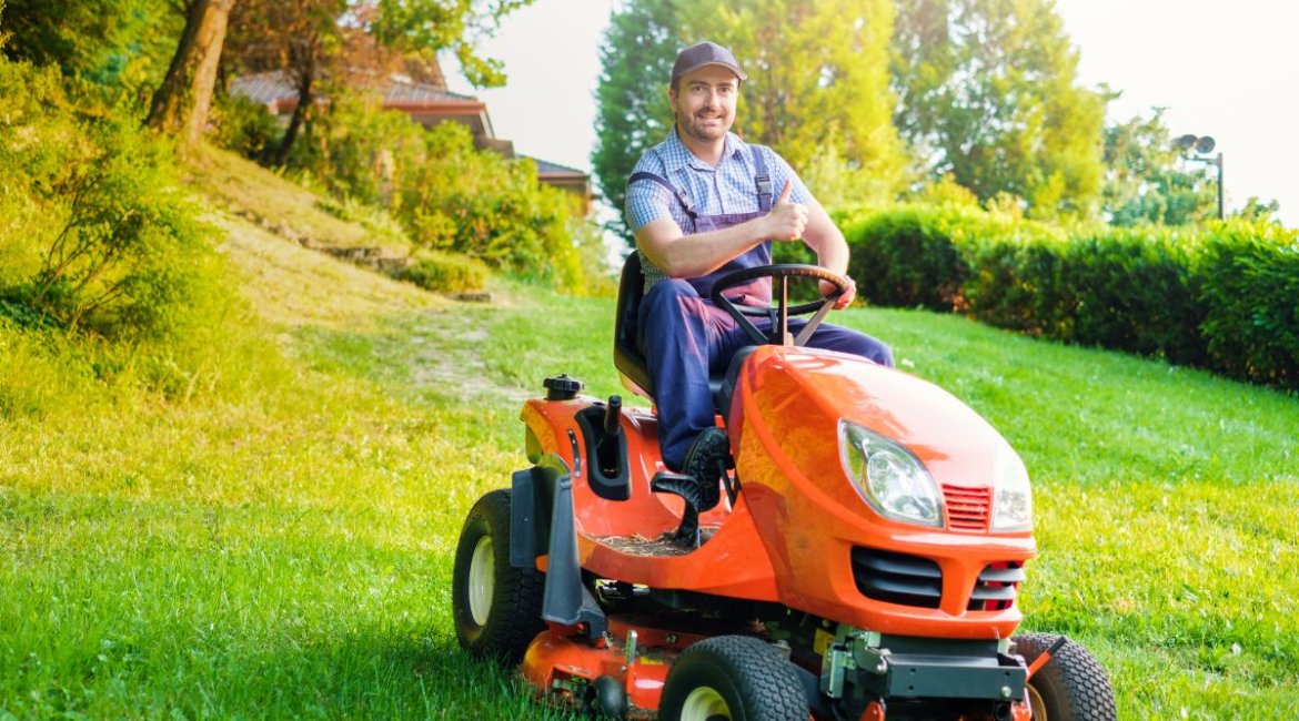 ride-on-mower-gardener-driving-a-riding-lawn-mower-in-garden-min