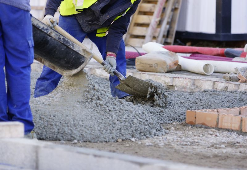 concrete-mixers-construction-workers-pumping-min