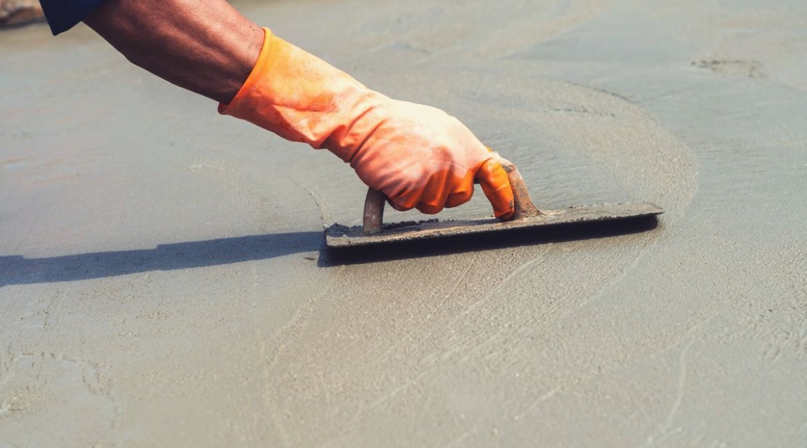 cement-mixers-close-up-hand-worker-leveling-concrete-pavement-for-mix-cement-a-min