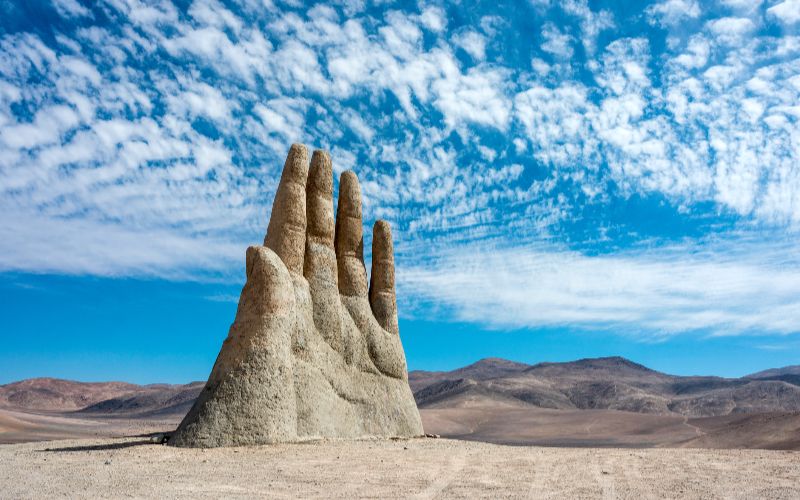 cement-mixers-hand-sculpture-atacama-desert-chile-min