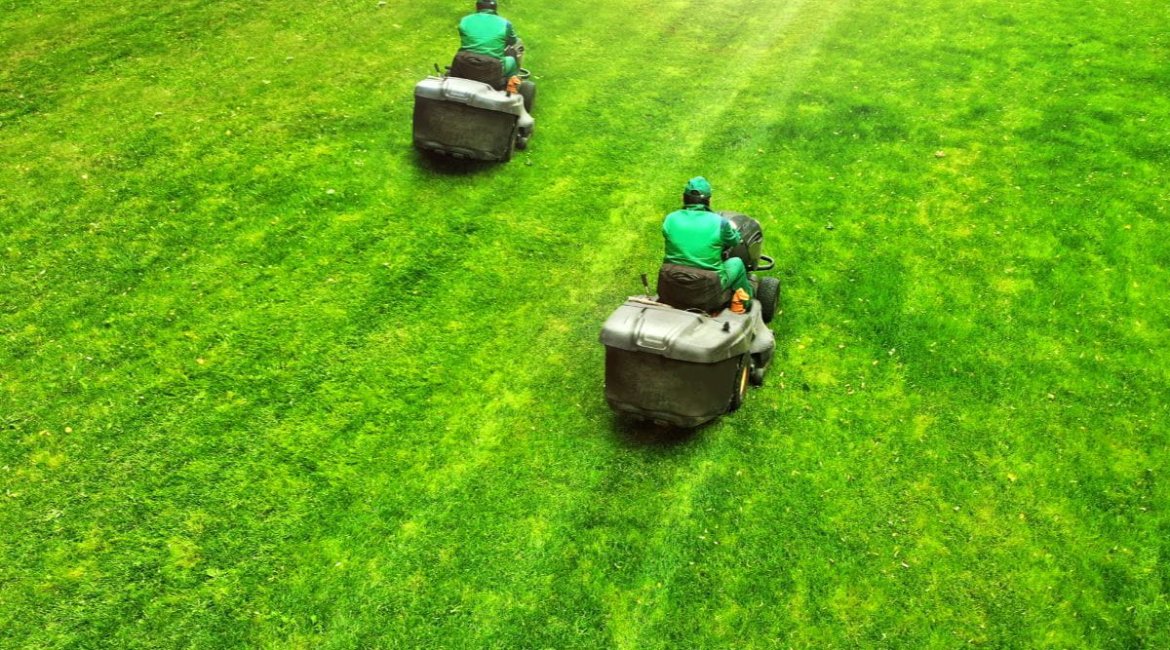 ride-on-mower-aerial-pair-of-lawn-mowers-on-a-grass-professional-gardening-background-with-a-two (1)