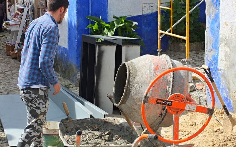 cement-mixer-construction-worker-mixing-cement-for-building-renovation (1)