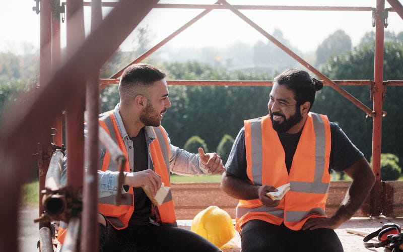 cement-mixers-happy-workers-in-construction-site-during-lunch-break