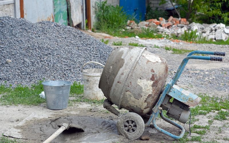 concrete-mixers-with-sand-and-stones-on-the-yard (1)