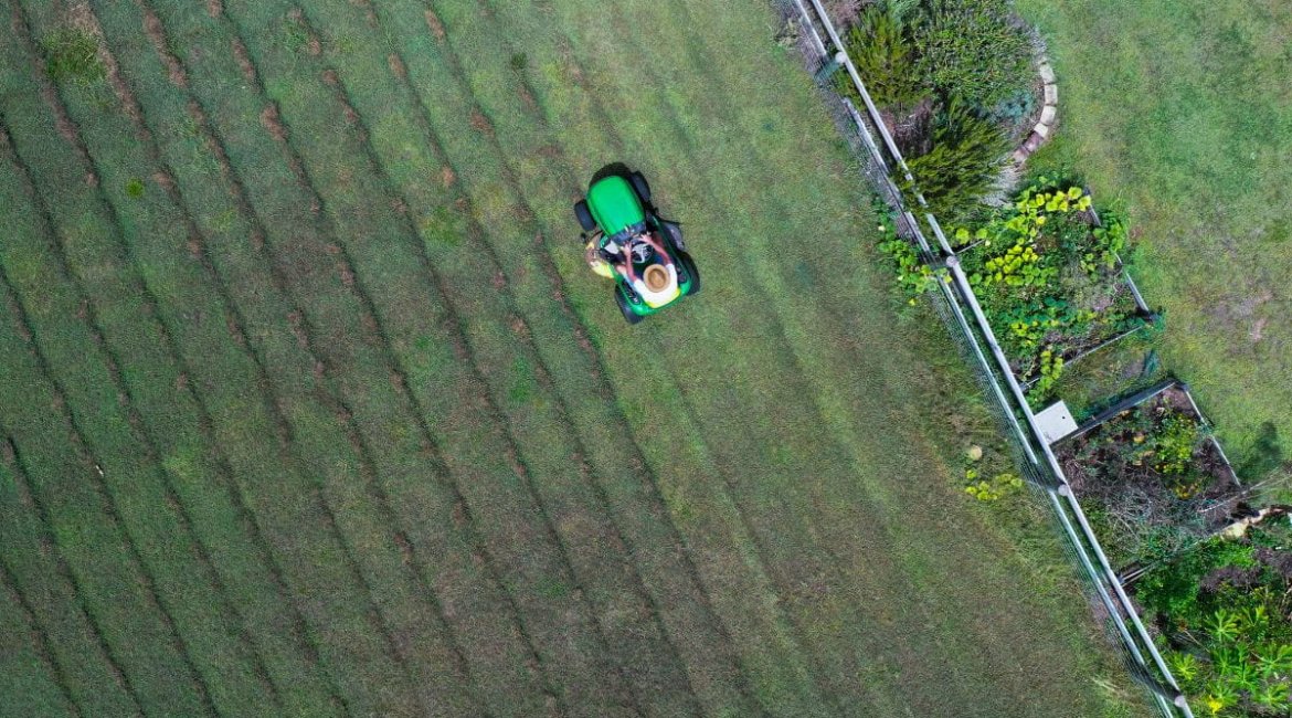 ride-on-mower-australian-man-riding-ride-on-lawn-mower-cutting-green