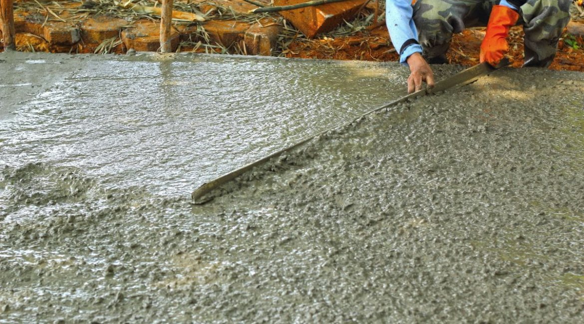 concrete-mixers-pouring-concrete-mix-for-road-construction-workers (1)