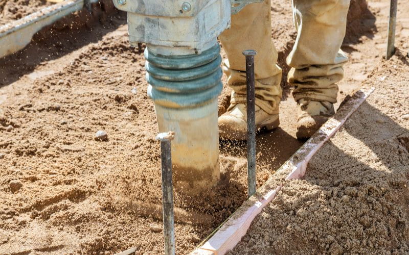 rammers-construction-worker-uses-rammer-to-compact-soil-at-building-site-during-work-day (1)