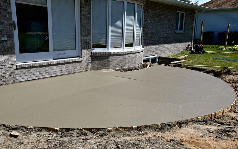 concrete-mixers-freshly-poured-concrete-outside-patio