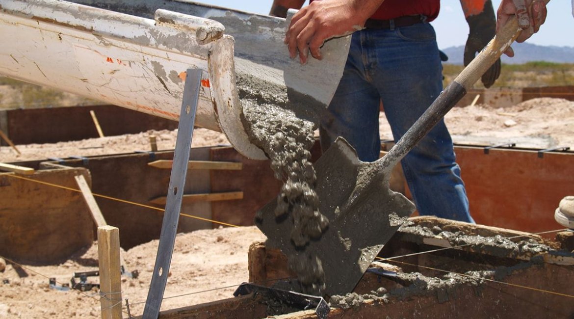 concrete-mixer-for-sale-men-guiding-cement-with-shovel-horizonta (1)