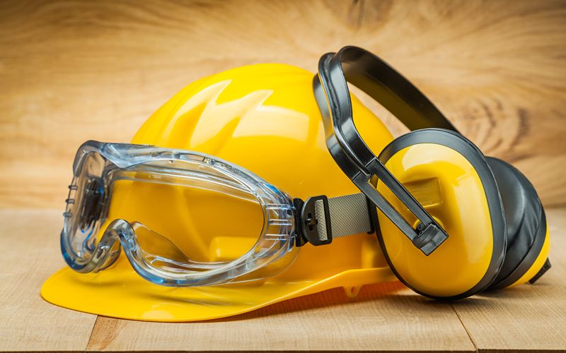 concrete-mixer-for-sale-safety-of-work-construction-safety-tools-yellow-helmet-blue-goggles-and-earphones-on-wood-background (1)