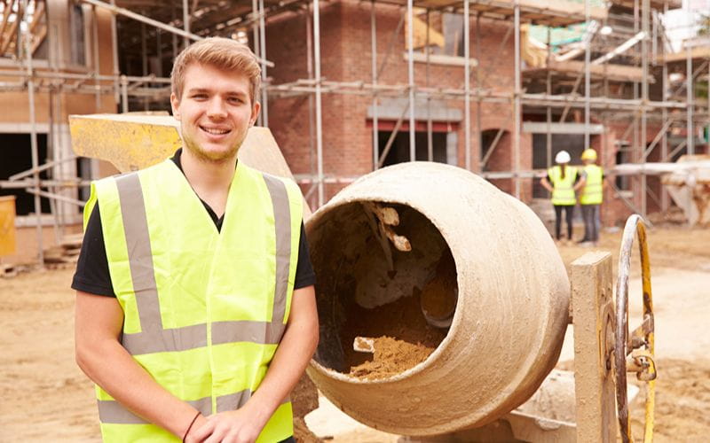 concrete-mixer-portrait-of-worker-on-building-site-mixing-cement (1)