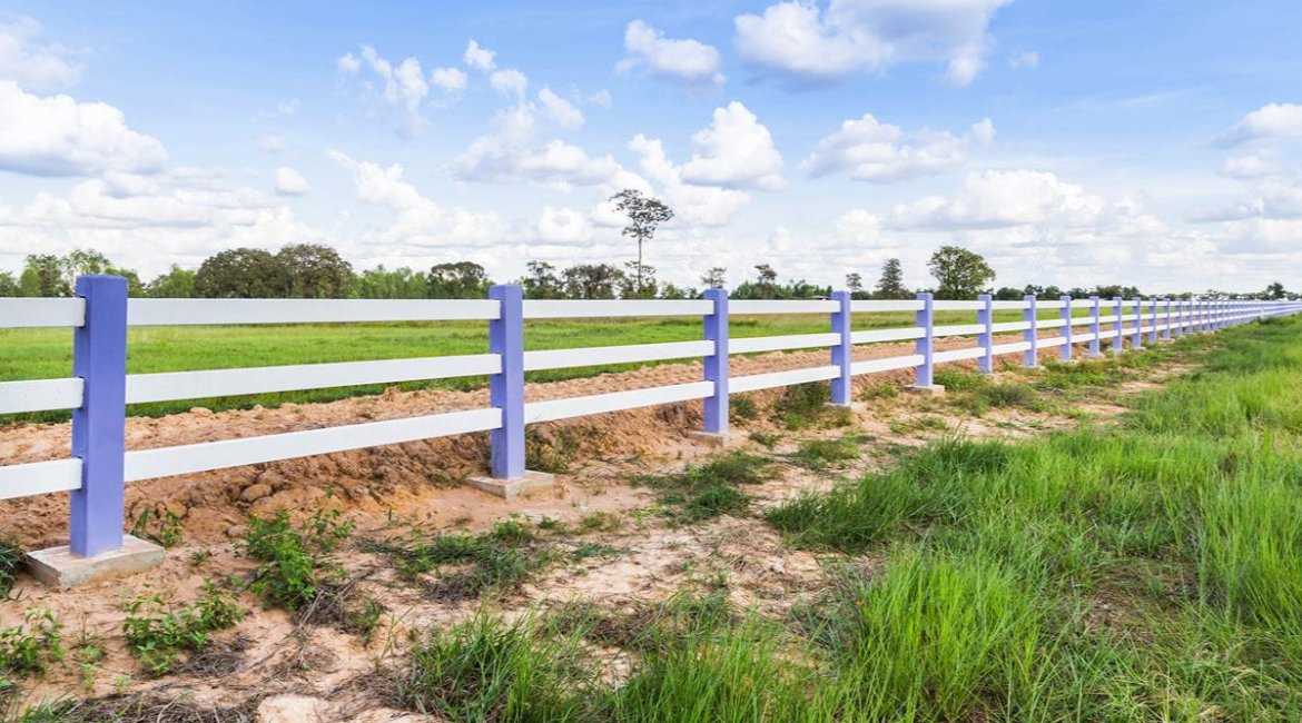 concrete-mixers-white-concrete-fence-in-green-farm (1)