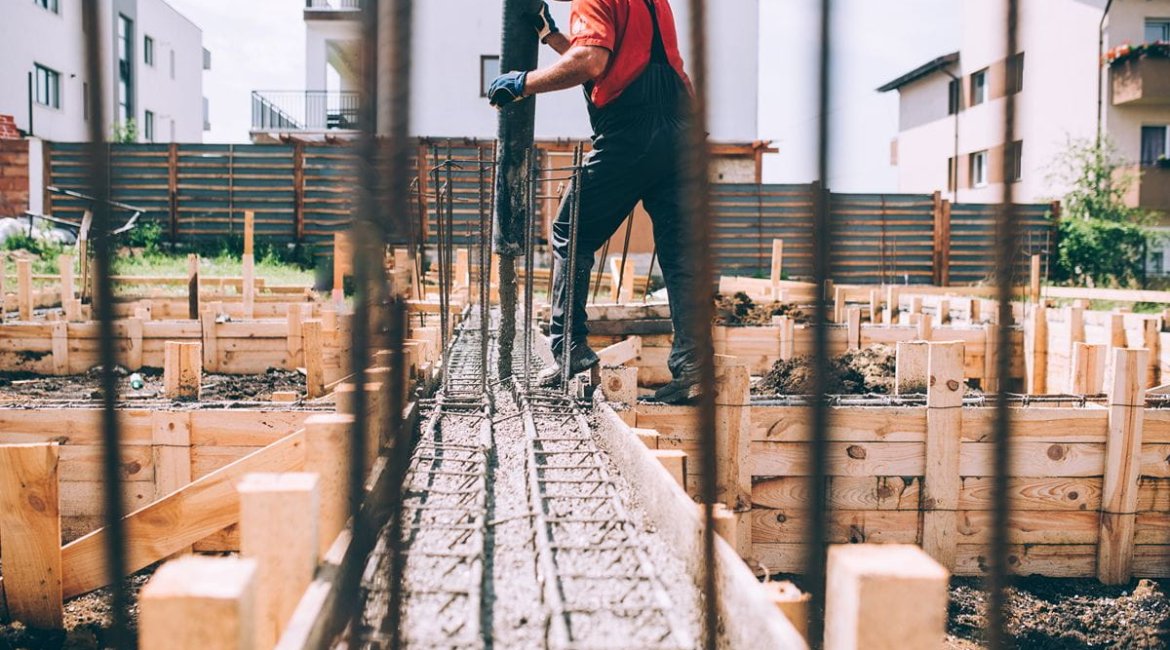 concrete-mixers-building-construction-worker-pouring-cement-or-concrete-with-pump-tube-details-of-worker-and-machinery (1)